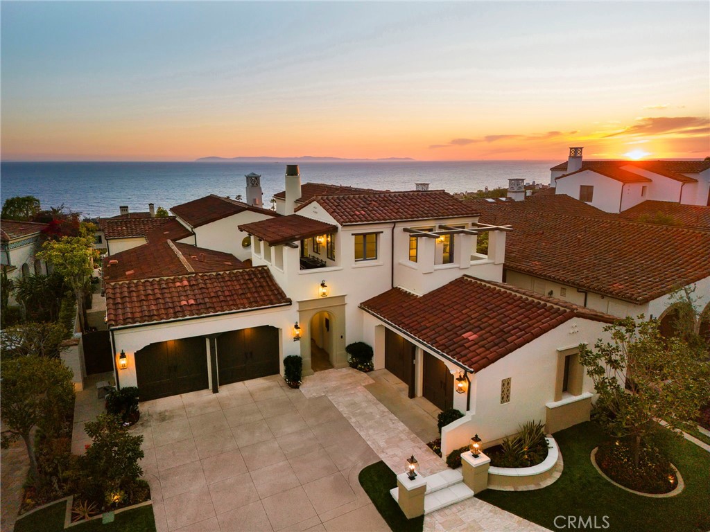 Nestled at the end of a tranquil cul-de-sac in Crystal Cove, this home is defined by luxury upgrades and expansive ocean views that sweep across the coastline, Catalina, and every sunset.
