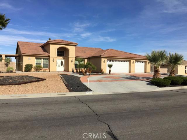 Wow! Come see this gem of a home. Custom built Sky Harbor home in the Copper Hills tract. Loaded with many upgrades and extras. Spacious living room, formal dining area and family room with dual side fireplace. Extra roomy kitchen with granite counters, lots of storage, center island and upgraded appliances. 4 bedrooms, 3 with attached full baths. Master BR is generously sized with 2 closets and slider to the patio and pool area. Backyard has a built in water pool and spa separately fenced and a covered outdoor kitchen with BBQ, sink, frig and plenty of room. Beautiful, expansive views too. 3 car finished garage. Custom, gated RV parking with 50 amp service connection. Stamped concrete driveway, Completely landscaped, block wall fencing and gorgeous! Come see this home before it's gone! (buyer to verify all information to buyer's satisfaction.) Association Amenities: None # of RV Spaces: 0 Special Features: SHNONE Lot Location Type: Standard Location Landscaping: Full # of Attached Spaces: 3 # of Detached Spaces: 0
