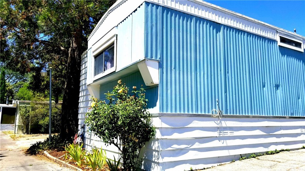 Bring all offers! Check out the view from this one! Newly re-sealed roof, new water heater and ALL plumbing as of March 2018, New flooring as of March 2017, custom touches throughout will help you to feel right at home. Even longer covered parking! Located just steps away from the clubhouse, this 2 bedroom 2 bath manufactured home offers level parking, indoor laundry, landscaping almost all around, and ridge-line and valley views. 12x12 Storage shed offers storage, shop space, art studio, or... ? Meticulously maintained and crafted for long-term living, this home will not disappoint. Includes all appliances, well appointed.
Buyer must obtain park approval before Escrow is opened.