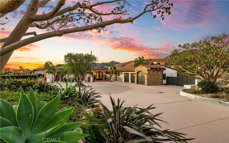 Your dream home finally has an address: 5941 Kanan Dume Road… and we know it’s your dream home because it boasts all four dream home elements: space to live comfortably, privacy to truly be yourself, views to inspire and luxury to delight.

Space: A romantic, 6,600+ SF Mediterranean estate perched on 4.3 acres of rolling Malibu hillside means room for everything and everyone – inside and out. And your very own mature, producing vineyard means the space that gives you room to breathe also gives you wine to savor.

Privacy: Your tranquility is ensured by a gated entrance and a dramatic driveway that lazily winds through your vineyard… the real world couldn’t be further from your mind. Inside, five generous ensuite bedrooms with direct access to multiple outdoor living spaces means that each guest has their own private enclave… without leaving the home.

Views: The estate’s beauty extends beyond its boundaries. Your views – framed by your vineyard in the foreground – include the legendary Malibu hills, the intoxicating Pacific Ocean and a nightly light show in the sky that stuns every single time.

Luxury: It’s rare to find a home that lacks nothing. But with a resort-like pool & spa, two levels of outdoor living, a private tasting room, a climate-controlled wine cellar, an in-home movie theater, a zen atrium and a convenient elevator, only one thing is missing from 5941 Kanan Dume Road: someone to enjoy it.

So raise a glass in celebration, because today your dreams became real.