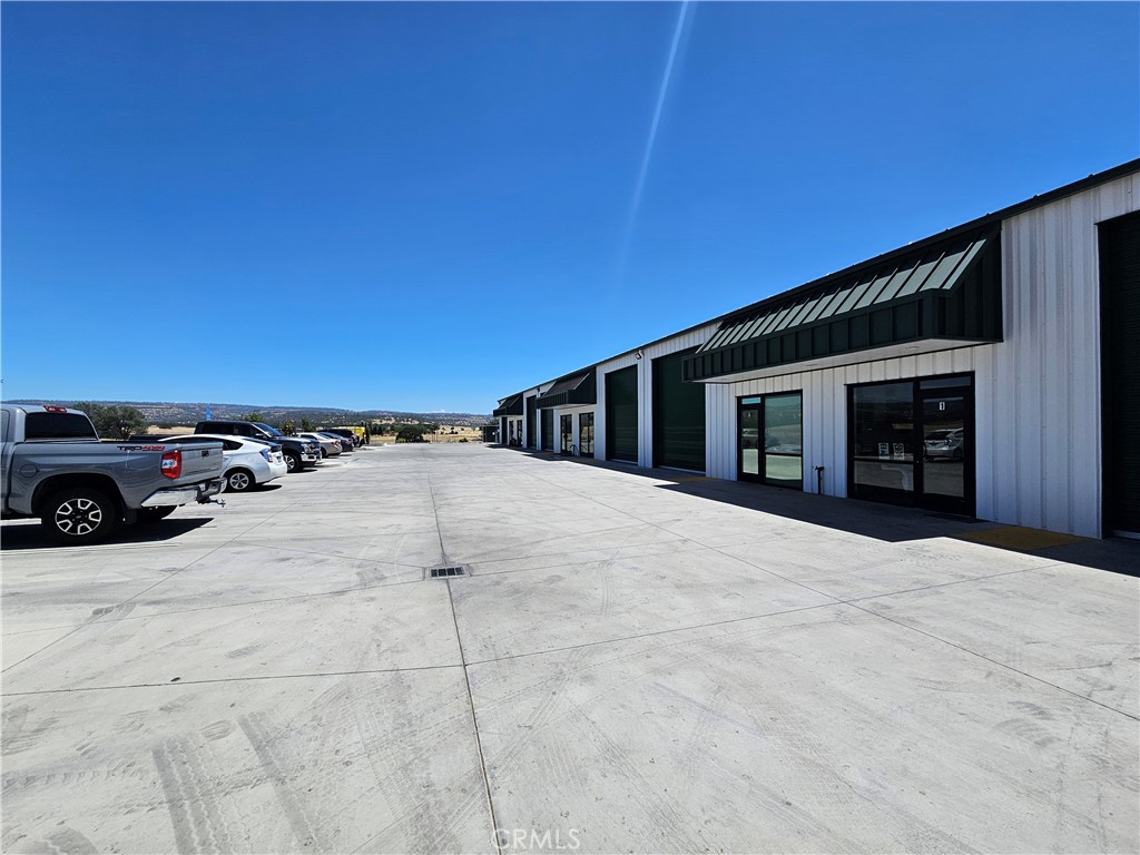 New warehouse space with a fenced and paved yard space. Suite 3 includes two roll up doors, private office, and private restroom. Great location with easy access.