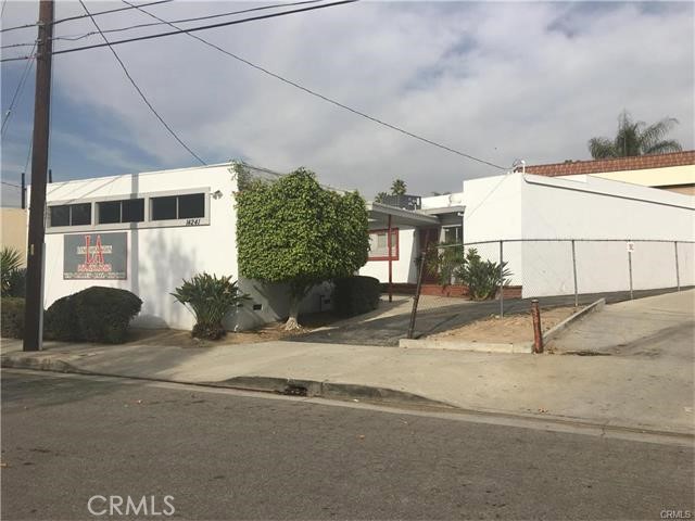 Two buildings on one lot. Front unit is one open room. Back unit has reception area, office, two 1/4 bathrooms and an additional large open room. Parking in rear of the lot.