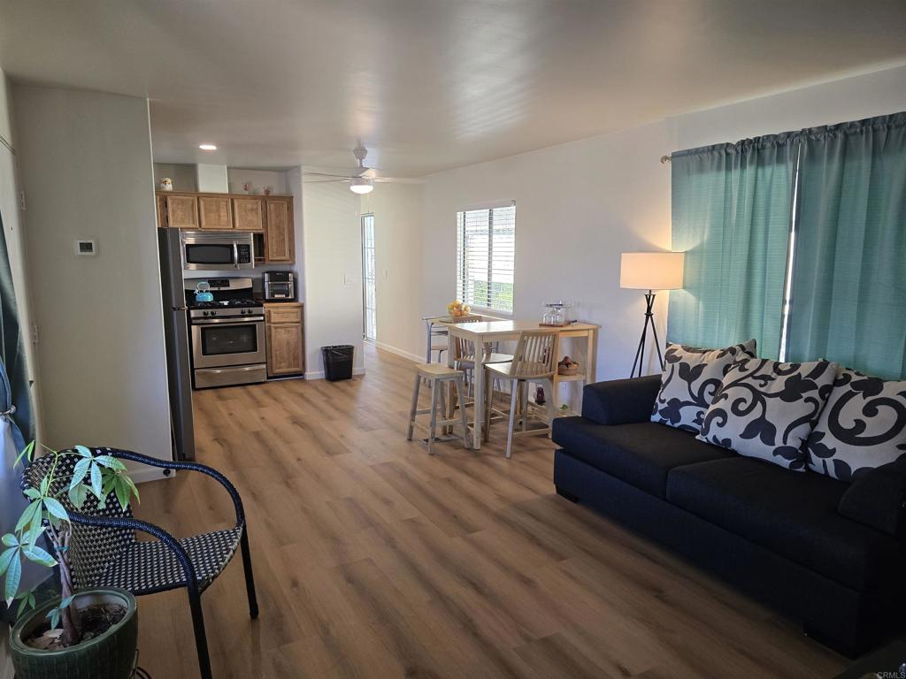 Newly upgraded unit in El Cajon. New interior paint and flooring. Spacious open floor plan that opens up to livingroom, dining room and kitchen. Second bedrooms sits at opposite side of the unit for added privacy. Second bedroom can be used as a bedroom, office or craft room with plenty of natural light. Unit has a covered two space carport with large shed in back yard for additonal space for storage. Sits close to onsite laundry room although this unit has a washer/dryer hookup in hallway. Park is well maintained with a recreational room and gated pool with views to the mountains. Conveniently located near shopping and public transportation. Must see to fully appreciate.