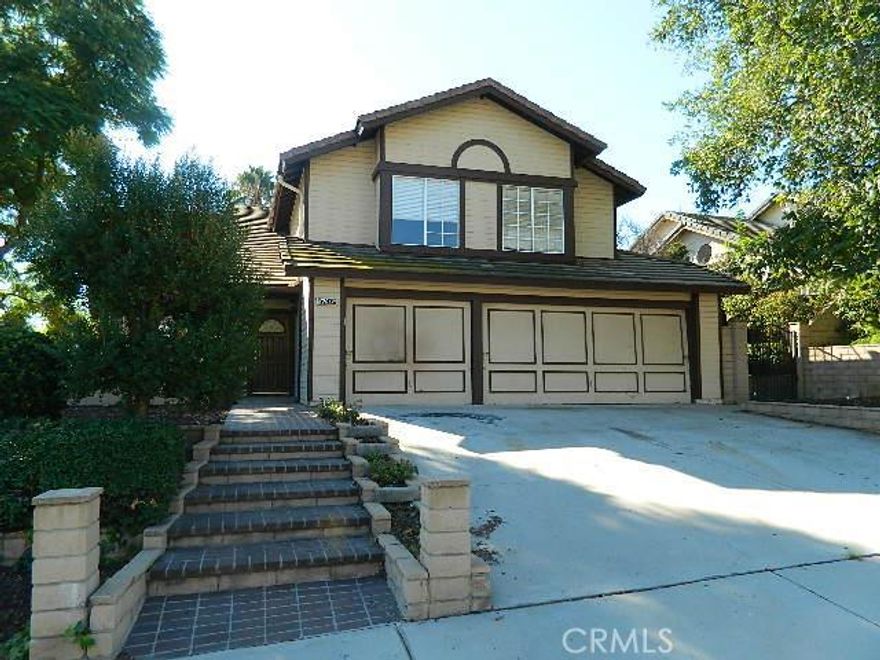 **HUD HOME** Box Spring Mountain Location offering you everything you need to make a Home!  Entry opens into the Formal Living and Dining Rooms with cathedral ceilings and large windows.  Kitchen has been updated with granite tile counters and looks out over the rear yard.  A warm and cozy family room offers a fireplace and wet bar area.  Laundry room and half bath sit off family room hallway which leads to direct access garage door.  Upstairs, you have three nice sized bedrooms and a hall bath with a large dual sink vanity.  Cabinets in the upper landing provide extra storage for linens and things.   The Master Suite is roomy and inviting with vaulted ceiling; the Master Bath offers dual sink vanity, separate shower and tub as well as a roomy walk in closet.  The rear yard adds to your home with an in ground pool, fire pit and BBQ Island, there is even a basketball hoop!  

***The master bedroom on the second floor has a French door leading to the large exterior pergola with large gaps in the flooring. It is not a balcony and not meant to we walked on***