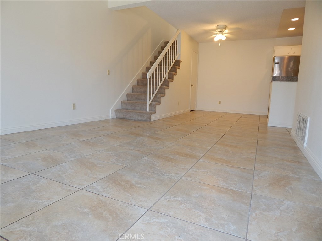 Great condo with spacious loft in beautiful Crosspointe Village. Upper level unit with large front deck. Stackable washer and dryer refrigerator, stove, dishwasher, and microwave included. This inviting one bedroom with loft boast a spacious living room, two closets in bedroom, a huge relaxing sunken bathtub, central heat plus ceiling fans. Ample storage areas & cabinetry and two large storage compartments above the 1 covered carport. Enjoy this complex serene gazebos and lush greenbelt grassy areas. One of three pools & spa are nearby as well. Private guard and gated community. Just steps away from trendy shops & eateries! Minutes away from major freeways.