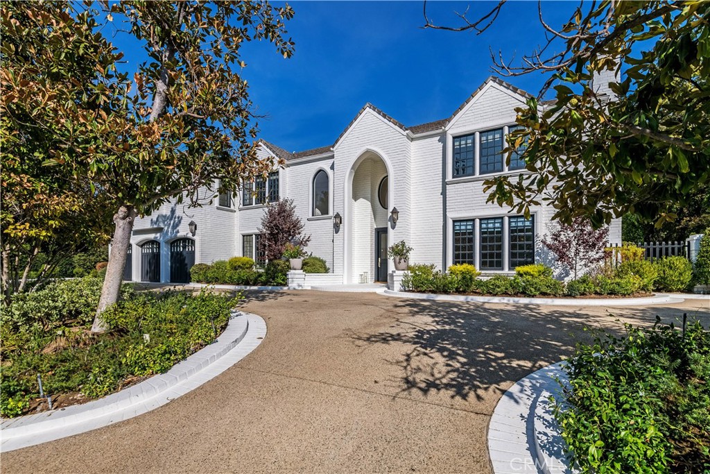 Located in the heart of prime Encino, this exceptional turnkey tennis court estate offers over nearly an acre of luxurious living. The meticulously designed, fully furnished 6,661 sq ft home strikes the perfect balance between privacy and elegance. High ceilings throughout create an airy, open ambiance, while the thoughtful layout ensures a seamless flow between spaces. The residence boasts 6 spacious bedrooms, 7 bathrooms, a formal living room with custom built-ins, a grand family room with soaring pitched ceilings, a dedicated laundry room, and a chef’s kitchen that opens to the poolside. Step outside to discover an expansive custom pool with a cascading waterfall, beautifully framed by lush landscaping. The estate also features a private tennis court with a charming gazebo-covered seating area, a fire pit, and plenty of room for entertaining. With its coveted location and undeniable appeal, this home is the epitome of sophisticated Southern California living.
