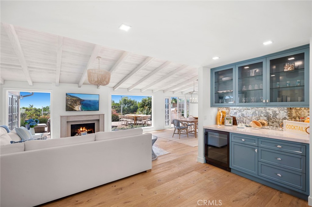 Experience Luxury Coastal Living at its finest in this newly renovated 4 Bedroom, 3 Bath Single Level home nestled within the highly sought-after Cameo Highlands Community in Corona Del Mar. Situated in an enviable location, this immaculate residence offers not only a wealth of modern amenities but also stunning ocean views. Step inside the private courtyard into your own private oasis: lounge by the sparkling pool, take a refreshing dip in the jacuzzi or simply soak up the sun. The light and airy floor plan, drenched in natural light is perfectly designed for effortless living and entertaining. The spacious living room features new French white oak floors throughout and soaring ceilings, creating an impressive ambiance, while large windows showcase the mesmerizing views beyond. A cozy fireplace adds a touch of warmth, making this the ideal space to relax and unwind after a long day. The chef's kitchen is a true masterpiece recently upgraded with new quartz countertops, Thermador appliances, a Bosch dishwasher and gorgeous custom backsplash by Artistic Tile. The adjacent dining area provides a seamless transition and creates a lovely atmosphere for enjoying meals with loved ones. Retreat to the primary suite, complete with a fireplace, sitting area, ocean views and French doors leading to the back patio. Pamper yourself in the luxurious en-suite bathroom, complete with dual Toto sinks, a soaking tub, and a separate shower. Three additional bedrooms and two impeccably designed bathrooms provide ample space for family members or guests. The back patio is a true highlight, featuring a built-in grill and plenty of seating area. Whether you're sipping coffee in the morning or enjoying a happy hour beverage while watching the sunset, it's a perfect spot for entertaining. The Cameo Highlands Community enjoys three private-access beaches, two community parks with playgrounds plus easy access to Pelican Hill Golf Resort and the many pristine walking paths through Crystal Cove. With its prime location near world-class shopping, dining, and entertainment options as well as renowned schools, this home offers the perfect blend of luxury and convenience. Don't miss this opportunity to make this your forever home, where every day feels like a vacation and memories are waiting to be made.