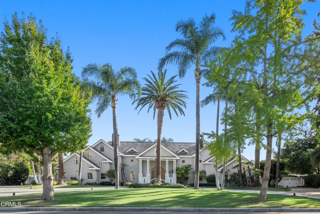 Quintessential California Palms greets you in the rounded driveway of this hard-to-find, .74-acre lot in San Marino's highly sought-after Huntington Library Estate Area. Boasting nearly 6000 square feet of space, the home features high box-beam ceilings, arched doorways and an abundance of natural light throughout with views of the gorgeously manicured grounds from virtually every room that are highlighted by a large pool, cabana and spa conveniently located at the rear of the property so you may enjoy the spacious green grounds and gorgeous zen waterfall pond in between. The property also features a separate structure which could be transformed into any number of separate spaces such as a pool house or home office. The interior of the home features a marble entry to a two-story height living room with a fireplace facing the tranquil backyard. One wing of the first floor includes a convertible den/office with an adjoining mirrored Barre/Pilates/Yoga studio with sauna rooms, and complete with an en-suite bedroom. The other wing includes the kitchen with granite counters and a breakfast bar, work desk, separate eating area and access to the three-car attached garage. Adjacent to the kitchen is a formal dining room with lighted built-ins and oversized family room with a wet bar and fireplace. The second floor hosts the primary suite with a walk-in cedar lined closet, fireplace and its own private balcony, along with a junior suite and two additional bedrooms with a shared bathroom. As a bonus, you're located just minutes from the bustling South Lake shopping district, Old Town Pasadena, Caltech, Huntington Library. The Rose Parade and you are a short commute away from DTLA, USC and more!