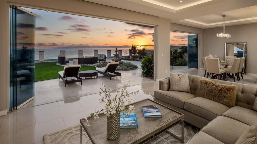 Rare new construction plus fully engineered upper & lower seawalls, only 7 houses to Beacons beach access. Savor the surf & beach from the 2,000 sqft ocean terrace or the private balcony off the luxurious master. Frameless glass doors leading out the terrace allows for an indoor outdoor lifestyle. Imagine yourself languishing around the large outdoor fire pit while marveling at the sunset. Easy living, this 3 story home lives like a single story, use the glass elevator with 3 story custom mosaic backdrop. Luxurious appointments abound in ideal harmony and inspires the senses with glowing Quartzite kitchen counters, mother of pearl wall, 24’ crystal chandelier, and limestone floors. The best of the natural world and technology has been thoughtfully entwined to create an elegant environment to soothe the soul. Your every comfort has been considered with full automaton Crestron System which includes; audio, visual, HVAC, electric shades, lighting, surveillance and security. Designated movie room could double as a man cave, teen room or sports den. Each bathroom has meticulously chosen custom tile, lighting, fixtures, and showers, two with steam showers! For the wine connoisseur, you’ll appreciate the temperature controlled wine cellar. Pick your favorite bottle and toast the good life while savoring the amazing coastal lifestyle. For the cook, you’ll revel in the extraordinary and exquisite details of the kitchen blending wood and under lit quartzite. Automatic SieMatic Walnut cabinets and Miele appliances create a seamless environment to create your meals and entertain with ease and grace. For the car aficionado, the gated driveway leads to a 2 car garage, that expands to 3 with a car lift system.Put the weekend convertible away until it’s time for drive down the coast, to one of the nearby restaurants or jump on a jet at nearby Palomar Airport, less than 15 minutes away.. Neighborhoods: Neptune Equipment: Garage Door Opener Other Fees: 0 Sewer: Sewer Connected...