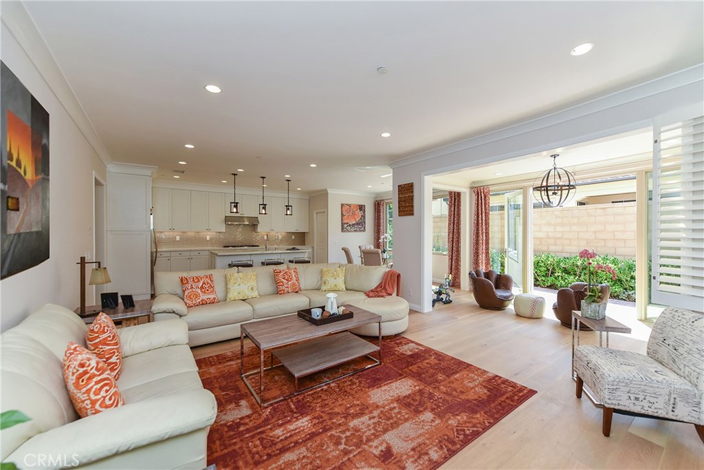 Huge Price Reduction! Seller is very motivated! Marigold Residence 3X, one of the most sought-after floor plans in the community of Cypress Village. This 3 Bedroom detached home is situated in the premium center location of Cypress Village with pool and parks in just steps away and far away from the noise/dust of Trabuco and Sand Canyon. This captivating home has many wonderful upgrades. The City/HOA permitted conservatory room lends additional living space that is perfect for children to play. Notable features including the oak engineering wood flooring, customized wood shutters, brand new customized quartz counter-tops with large island and full back splash. There is also a bonus loft area upstairs convenient for Tech/Study. The master bedroom suite includes a walk in a closet and a master bathroom with customized Italian tile, spacious dual sink vanity and contemporary glass shower enclosure. Conveniently located within 5-10 mins walk to the Awards winning Cypress Village Elementary and Jefferey Trail Middle school and shopping centers.