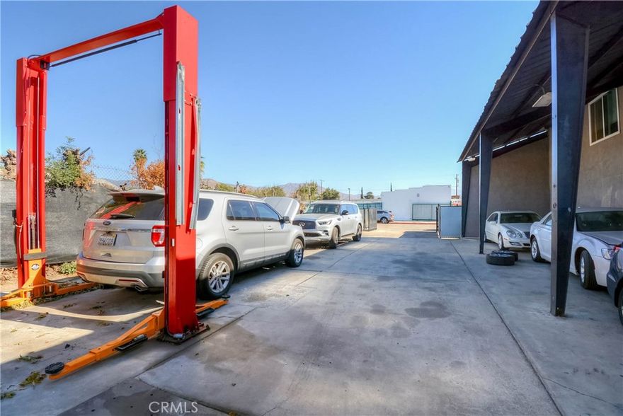 Property consists of 7,964 sq-ft buildout with a two rentals income at $3,800 per month and 10 open bays with 3 office spaces and 3 restrooms and 2 showers. Property extends from Tippecanoe Ave to Base Line in shape of an "L". There are two parcels which together adds up to 20,056.