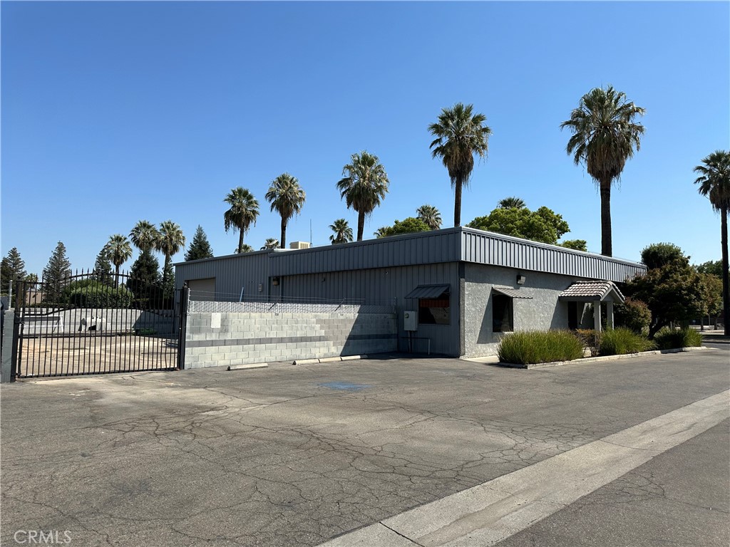 A freestanding, single story, approximately 4,800 SF warehouse building on a roughly 12,196 SF lot accessible from Olive Avenue and DeWitt Avenue with private fenced yard area. Suitable for light industrial use or office use. Formerly a construction office with open warehouse space and office space with the gated parking area. Ground level roll-up door into the warehouse area. Room to park large vehicles or equipment. Office area contains 6 designated offices, a large conference room, front reception area leading into two open desk/file or storage areas, and two single restrooms. Use perfect for another construction office, automotive use, office use, storage, or other light industrial use. Buyer to verify its use with City of Fresno. Ready to occupy now. South of the Fresno Air Terminal, just west of Clovis Avenue/Olive Avenue. Neighboring businesses include BMY Construction Group Inc., Napa Automotive, and to the west, the CHP, Fresno Metropolitan Flood Control District, and to the east, some city offices being built out currently. Amazon Delivery Facility to the south and the Fresno Air Terminal to the north.