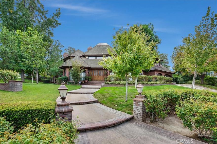 Amazing Hawarden Hills Estate home situated on a 1/2 Acre. Make your way up the steps to the inviting entry way and welcome home. Just inside you'll find the step down living room with built-in cabinets. Further down the hall is an office/5th bedroom which leads into the huge family room with a floor to ceiling brick fireplace, unique coffined ceiling, and wet bar.Downstairs also features a 3/4 bathroom with dual sinks. Now make your way into the spacious kitchen with a beautiful hand painted mural and features granite counter-tops, double oven, island w/cook-top, SS appliances, and tons of counter space. Now make your way into the formal dining room. There's is also an indoor laundry room which leads into the huge 3 car garage and don't miss the wine cellar. Now make your way up the spiral staircase to experience the other half of this phenomenal estate where you'll  find a  bedroom with its own retreat with fireplace and balcony. Now make your way into the Master bedroom retreat with its own fireplace and covered balcony. The attached Master bathroom has tile a huge walk-in closet, and separate tub & shower with stained glass mirror. Now make your way into the backyard of paradise with sparkling pool & spa, built-in BQ, and lush landscaping.