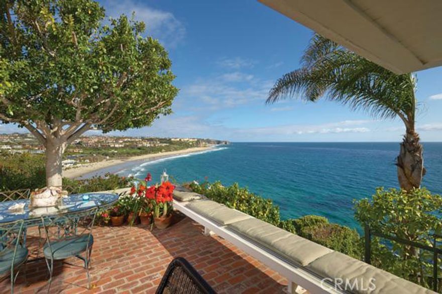 Perched on one of the largest and most secluded oceanfront lots along the bluffs of Monarch Bay, this gorgeous custom residence is perfectly positioned to capture panoramic ocean views from Salt Creek to the Strand at Headlands and beyond Catalina Island. Privacy abounds as you enter through enchanting gardens to a beach house retreat with seamless indoor-outdoor living spaces. The 4 bedroom, 4 bath property features timeless qualities that blend sophistication with a relaxed seaside atmosphere, including antique Georgia pine floors, open beamed ceilings and Carrera marble kitchen counters. Unwind on the spacious enclosed patio as pelicans soar overhead and waves crash below this picturesque resort-style abode. Monarch Bay is an exclusive gate guarded community with the only private beach club operated by the St. Regis Resort. Other premier amenities of this luxurious community include a private tennis court and pristine recreation area.