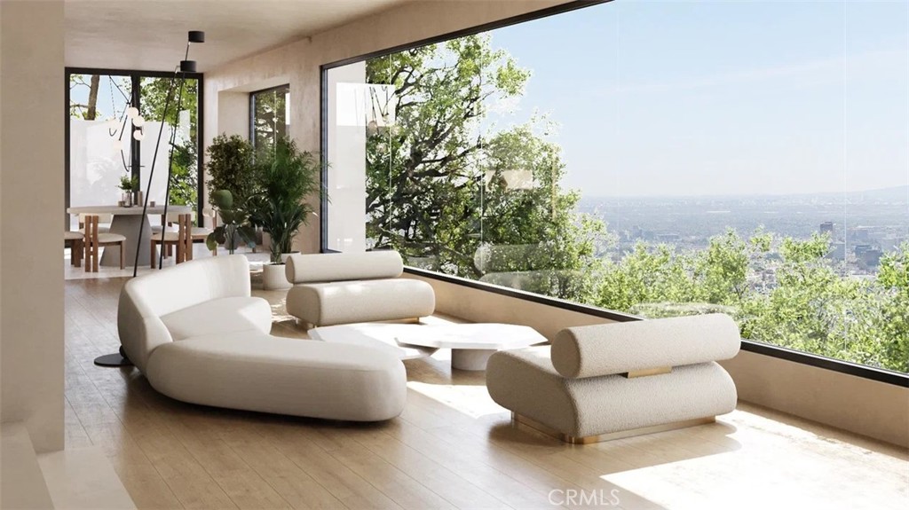Stunning Contemporary home situated in the celebrity enclave of Oak Pass Road. The community is gated and private while the property itself is additionally gated and sequestered down a private drive. The recently built modern offers amazing views from every room with walls of glass creating the perfect indoor/outdoor flow. A unique enclosed glass hallway expands over the pool and serves as a centerpiece for the main level. A dual fireplace connects the living room to the office (could be converted into the 5th bedroom) which leads up to the expansive master suite. The large master offers dramatic views, huge walk in closets and a spa-like master bathroom. Additionally there are three generous guest bedrooms. The gourmet chefs kitchen, theatre/media room, and three separate decks create an ideal home for entertaining guests. It is truly an one-of-a-kind master piece property sitting on over 1 Acre land. Perfect for entertaining!