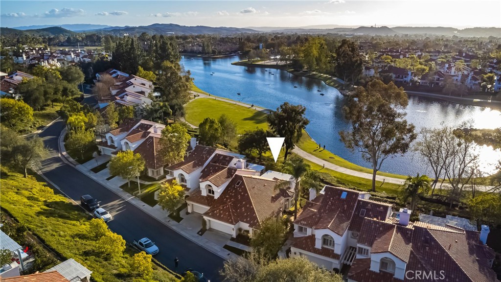 Discover the fabulous Marbella lakefront community in Rancho Santa Margarita - you’re not just buying a home but a lifestyle! This light and bright SINGLE STORY, end-unit home located on a single loaded cul-de-sac has been updated, remodeled and is move-in ready! Amazing views from the living and dining room, master and patio overlooking the lake. Prepare family feasts in the kitchen with newer, stainless steel appliances and custom granite. Master bath has been recently completely redone. This incredible home sits right in front of the lake and has a winding walking path just outside your back gate. The mile walk around the lake, includes places to stop and shop; the Lago Santa Margarita Beach Club, community pools, stores and restaurants too! Everything you need is close by; including O'Neill Regional Park, fantastic hiking and biking trails, various shopping malls, and easy access to all the major cities nearby. Entertain year round in your own backyard boasting incredible sunset and early morning views - your own private venue for watching the fireworks on 4th of July! Don’t miss out on this amazing lake view home!