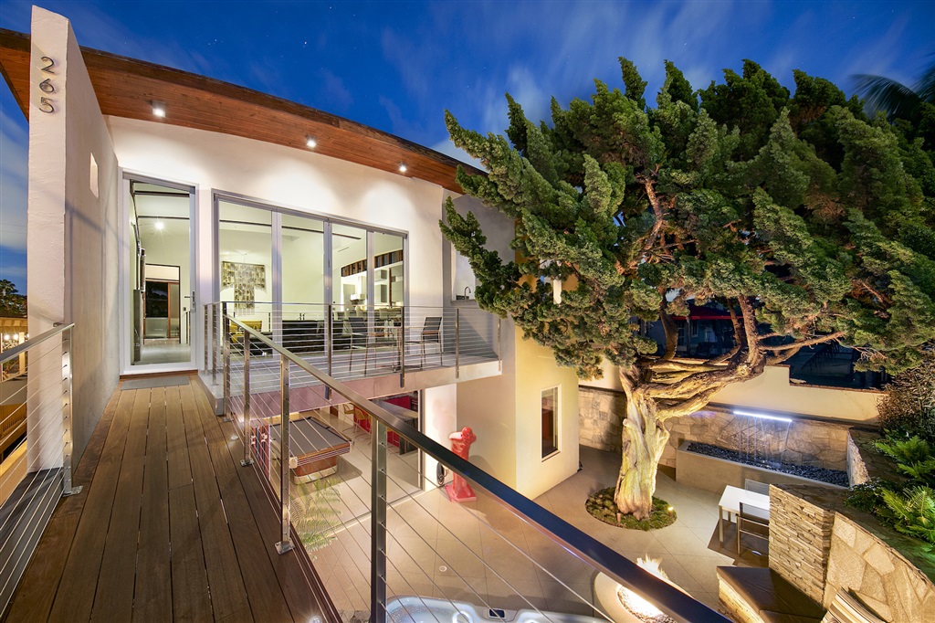 Stunning, contemporary masterpiece, just steps away from Stonesteps beach access. A sophisticated, extensive remodel was completed in 2018 w/ ultra high end materials w/ supreme attention to detail. Amazing home for entertaining w/ La Cantina Doors flooding the home with natural light on both levels creating an indoor-outdoor lifestyle. Open, creative floor plan. Gourmet kitchen with 9' Tamarind wood dining area. Stroll to Encinitas coffee shops, restaurants & beaches. Must see the Professional Video Click on "D" to see COMPLETE LIST OF IMPROVEMENTS & click Virtual Tour to see the video. Stunning Custom Beach Home, originally designed by Jennifer Luce. Complete interior remodel and upgraded exterior completed in 2018. Open floor plan, lives like a single level, fabulous gourmet kitchen, Wolf appliances, new cabinets with blum drawer and handleless system, subzero refrigerator 54" wide with wine fridge, 9' Tamarind wood island in the dining area, dumbwaiter to lower level bar area, Lynx BBQ off kitchen. Check out the hidden TV behind art in the living and master bedroom. First floor is all tile flooring and downstairs is poured concrete. Don't miss the custom walk-in closet in the master bedroom, spa like bath and large private deck. Downstairs area, huge entertaining area with a custom bar, Cantina doors to private yard with 6 person spa, fire pit, waterfall. Weight room is the 3rd bedroom. 2.5 car garage with storage, Tesla supercharger. New plumbing & Electrical. Enjoy the good life at this premiere coastal home!. Neighborhoods: Leucadia Equipment: Garage Door Opener Other Fees: 0 Sewer: Sewer Connected Topography: LL