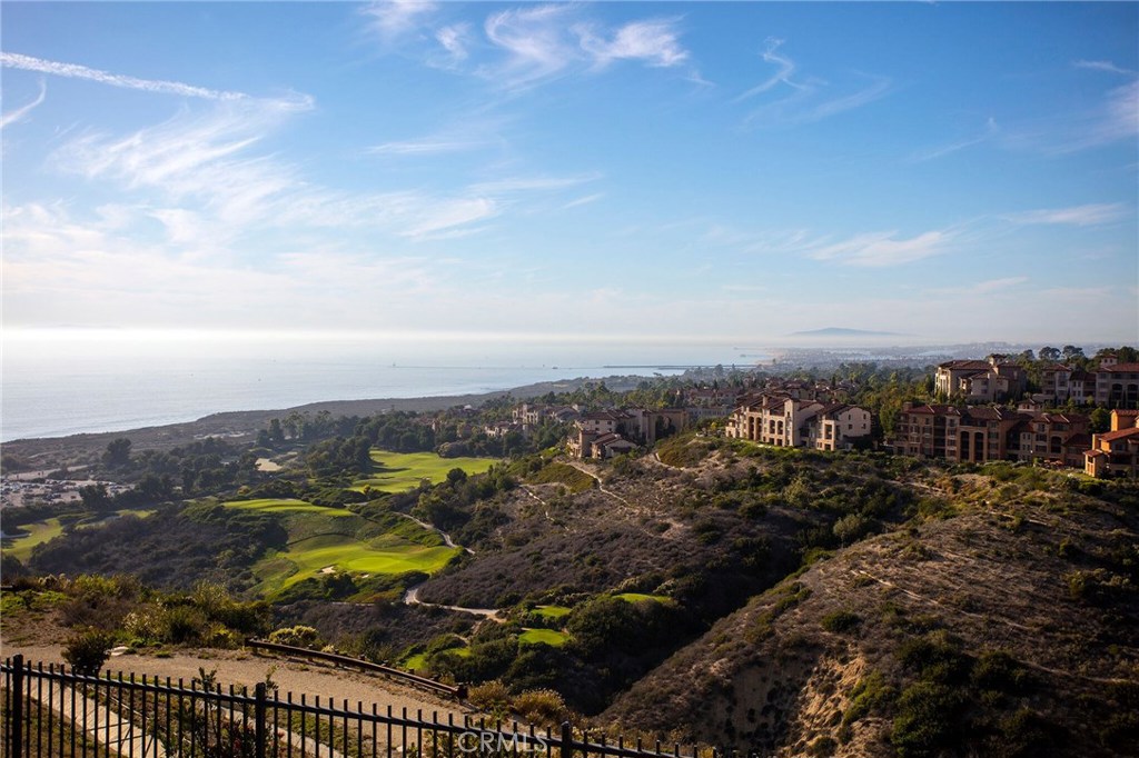 Truly one of the most spectacular lots in all of Crystal Cove. 7 Del Mar is the last true front row lot available with amazing views of Pelican Hill Golf Course, Newport Harbor, Catalina Island and the deep Pacific Ocean to Palos Verdes with year round sunsets.