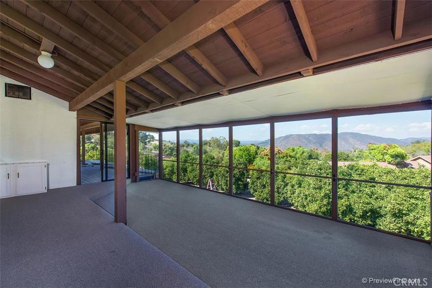 Come enjoy easy country living in your new home! Quality construction, breathtaking views, excellent convenient location and includes a permitted guest house with an attached garage for car enthusiasts. Currently in original vintage decor including solid core doors, oak cabinetry and tile counters. Timeless and inspiring views from inside as well as the large deck. Healthy Citrus grove, plenty of parking for RV or whatever. Multiple extra rooms, one of which is a converted garage bay. Much to see!