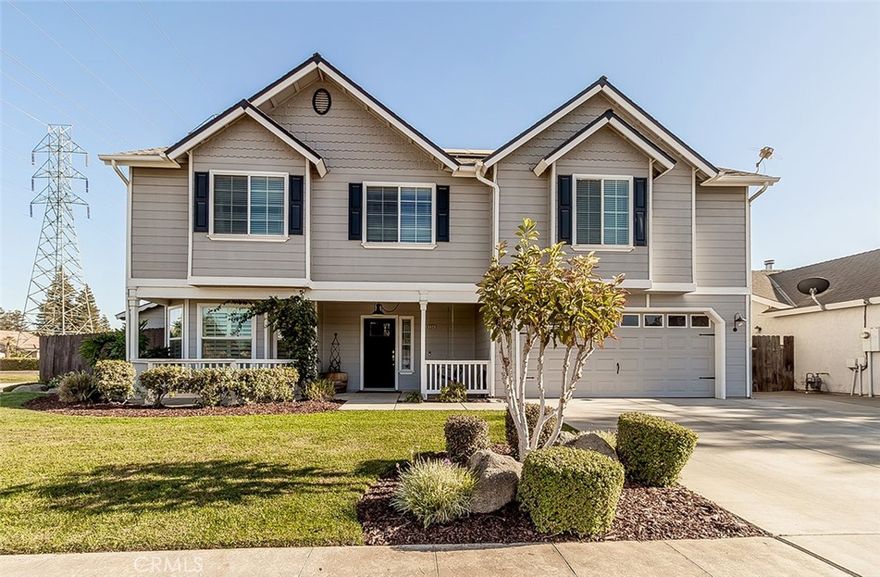 This immaculate NW Fresno home  with an inviting front porch and sitting area has 4 bedrooms and 3 bathrooms with an exceptional floor plan and living space for every member of the family.  The home has been upgraded throughout and very well maintained. The designer upgraded kitchen has quartzite leathered finished countertops accented with subway backsplash, all with lovely coordinated appliances including gas cooktop and cabinets. In addition, the kitchen area has a very nice eating bar and dining area with shutters and a view to the front yard. The open great room area has a double sided fireplace and a very spacious dining room area too with views to the side yard area. Adjacent to this area is a wonderful multipurpose flex room that could be an additional bedroom, office etc. with a door to the rear yard. Downstairs is a private bedroom and bathroom with another door to the backyard. Upstairs enjoy 3 additional bedrooms and a loft area/game room for all your lifestyle needs and relaxation. The primary bedroom has  its own upgraded deluxe bathroom with a beautiful shower and separate tub. The view from the top of the stairs gives you a wonderful feeling as you enjoy all the lovely features this home has to offer. The rear yard is like its own tropical oasis with a relaxing firepit and pool with its own waterfall and lights. The stamped concrete is a great touch plus the nicely planter areas. You will find the well built playhouse/man cave and/or she shed a welcome addition and multi purpose for all your needs. You will say this listing feels like home with all the extra touches that you will experience during your visit.