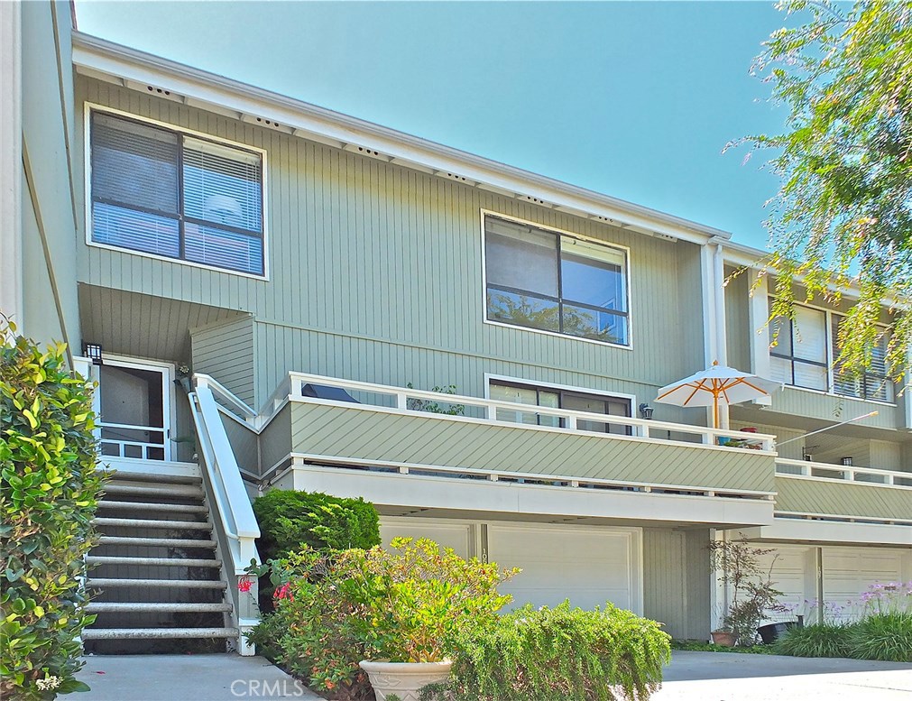 Nice ocean breezes at this turnkey home in the desirable Newport Crest community and sitting above the bluff overlooking Newport Beach’s prized Peninsula. This well kept largest model has been recently renovated with tasteful detail and high quality design and materials.
Enter to an open floor plan with travertine flooring, faulted ceilings and a wall of windows that flood the home with natural light. A private balcony off the living room creates a seamless transition between indoors and out and the mature landscaping provides privacy and wooded charm. In the kitchen: granite countertops, newer stainless appliances, custom cabinetry with built in wine rack and desk. A sizeable living area adjoins the kitchen and a sliding glass door serves to merge indoor and out with a private balcony with a peek-a-boo ocean view with nice ocean breezes.
The living room, stairs, and upstairs and are all appointed with Brazilian teak wood floors- and they're amazingly beautiful. Upstairs: a partial ocean view in one of 4 bedrooms and a newly renovated bathroom. The master has a large walk in closet and en suite as well as a slider that opens to yet another private balcony that is sheltered by mature trees that allow a natural flow of nature within.
Community amenities: pool, spa, Jacuzzi, BBQs, tennis courts, paved trails, private entrance to a large ocean view park. Ideally located near the beach, restaurants, shops, Hoag Hospital, freeways and airport.