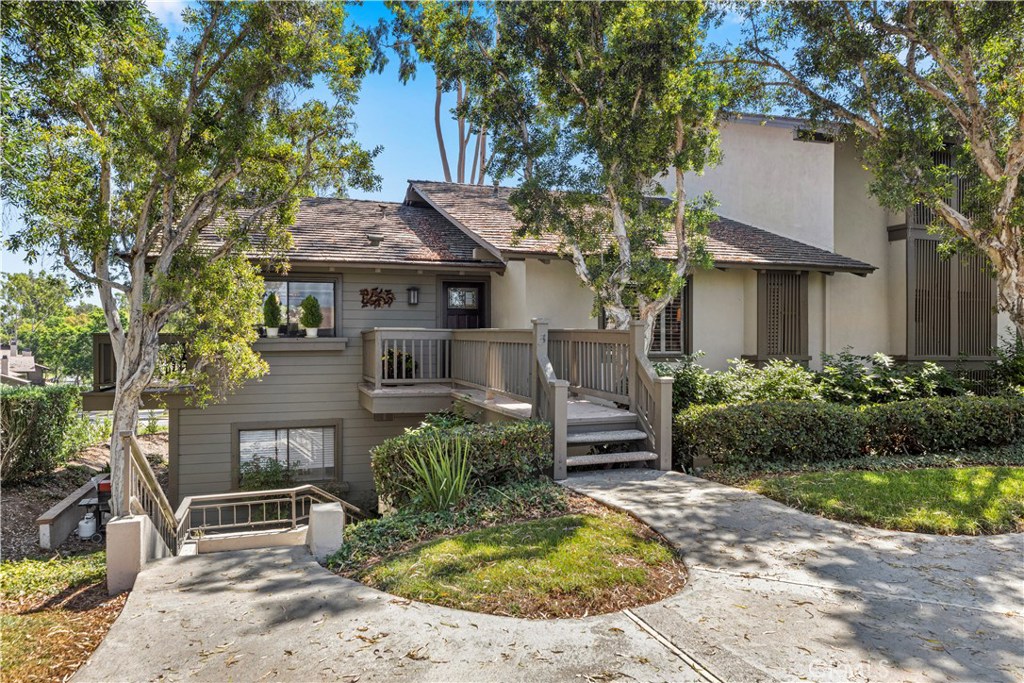 Nestled in the highly desired community of Rancho San Joaquin lies this upper level, end unit 2 bedroom, 2 bathroom condo surrounded by beautiful tree-lined streets and greenbelts. Upon entering the home, you will notice the carefully placed craftsman entry door and well maintained engineered maple hardwood flooring, gourmet kitchen with Quartz counter tops, double oven and Kohler sink with an abundance of natural sunlight flowing into the home making it light and bright throughout. The luxurious master suite features high vaulted ceilings, remodeled bathrooms with granite counter tops, travertine flooring and walk in shower with high quality stone throughout. The open floor plan is ideal for entertaining guests with high vaulted ceilings, custom stone fireplace and two outdoor balconies with retractable awnings which make it easy for to relax and unwind. Community amenities include two resort pools, spas and HOA dues include trash, water and exterior maintenance. Conveniently located next to Rancho San Joaquin golf course, Mason Regional Park, UCI, world class shopping, Fashion Island, South Coast Plaza, OC beaches and zoned to highly rated University High School.
