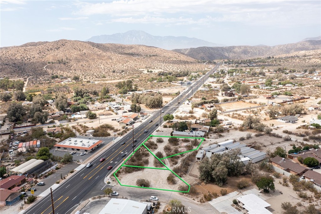 Highway Front vacant lots (3-parcels) zoned General Commercial – buyer to check. Burgeoning Morongo Valley is finally getting the attention of its more famous neighbor – Joshua Tree – up the hill. New businesses and development on both sides of the highway. Morongo Valley remains the gateway to Joshua Tree National Park and Pioneertown – the majority of the 2+ million visitors to those location pass by this parcel. Prime location. (Street address is approximate, not assigned by the County; green lines demarcating parcel are approximations, not survey marks.) To locate property use APN: 0583-241-03