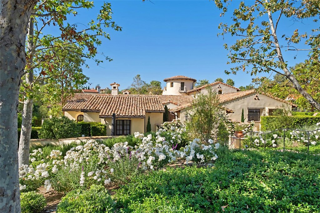Custom-estate on a quiet cul-de-sac in coveted Shady Canyon. Private front courtyard entrance . Formal living room with Antique French terracotta tile, fireplace, custom fir wood doors leading to centered courtyard with fireplace. Formal dining room with raised beam ceiling. MAIN FLOOR MASTER SUITE with custom wood fir doors leading to private spa.His & hers separate walk-in closets w/custom built-ins. Spa inspired master bath w/ dual vanities, steam shower, free standing soaking tub, heated floors all tile intricately designed.In home office with builtins & fireplace. Gourmet kitchen featuring large island butcher block counter, 2 sink areas, 2 dishwashers, 3 ovens, 6 burner cooktop, and a commercial grade WALK-IN fridge. All opening to family room with fireplace and breakfast nook.Butlers pantry offering icemaker and wine fridge.Upstairs are three secondary bedrooms plus a bonus room.Basement w/great room offering fireplace, built in bar, wine tasting room and wine cellar accommodating 1800 bottles. Additional en-suite bedroom. Separate guest casita w/full bath. Resort rear yard w/built in bbq/ice maker/fridge. Secondary outdoor fireplace, pool/spa. Large grassy area with adjoining Napa garden. Laundry room w/dual washers and dryers. Two main floor powder rooms. Private motor court easily accommodating an additional three cars. The quality of construction ,materials, attention to details, sprawling grounds designed by Rodgers Gardens makes this estate a unique offering.