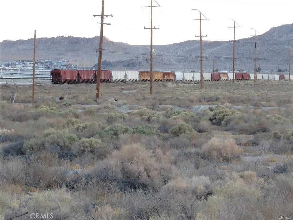 There is not an address associated with this parcel. What is reflected is the Parcel# 0486-192-02-0000 which is 0.132 Acres. Zoning is CR (Commercial Rural).Located in Trona which is an Unincorporated area of San Bernardino County. Power less than 50 ft. away.
