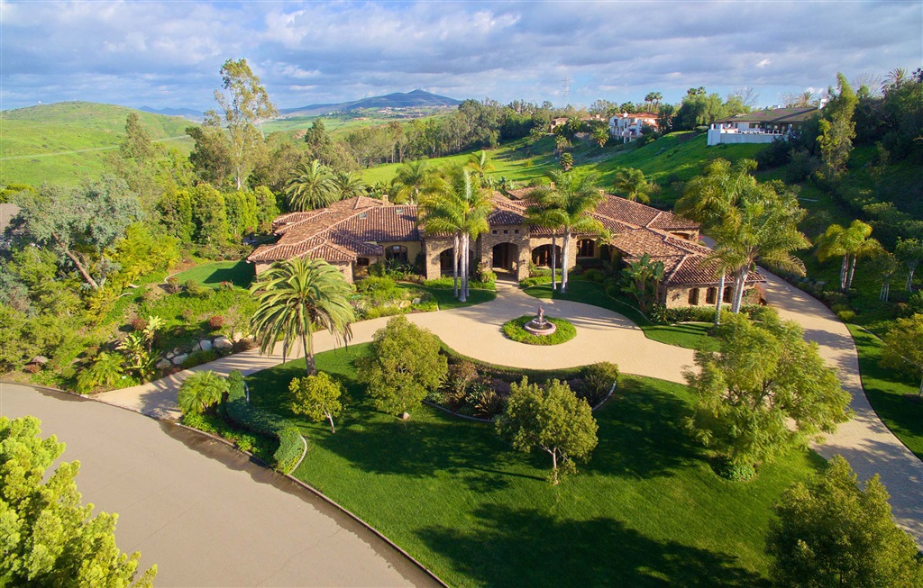 Auction Now Open for Bidding. Selling at or above $4M on 2/28 (cont) the estate easily lends itself to entertaining and effortless indoor/outdoor living. Enjoy the sun drenched chef’s gourmet kitchen and grand family room. The indoor/outdoor living room overlooks the resort-style pool and spa, which features multiple waterfalls and is surrounded by lush greenery and a citrus orchard brimming with orange, lemon, grapefruit, and lime trees. The master retreat features its own exercise room with sauna and steam shower, in addition to a lavish master closet complete with a dressing area. Grand architectural details abound in this magnificent estate including the amethyst crystal chandelier from 1760 proudly on display in the formal living room, along with open beam and intricately painted groin ceilings. Offering five bedrooms, an attached guest house with living room, bedroom and bath, a Director’s theater, an executive wood paneled office, wine room, and a huge billiards room, this sophisticated estate is the perfect blend of classic and contemporary style, and ideal for entertaining as a family or for hosting large parties and events.. Neighborhoods: Fairbanks Ranch Equipment: Dryer,Garage Door Opener,Pool/Spa/Equipment, Washer Other Fees: 0 Sewer: Sewer Connected Topography: LL