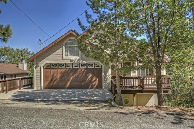 Level entry into this 4 bedroom/4 bath home in Lake Arrowhead with Lake Rights. You have level entry into an over sized living room with vaulted ceilings and river-rock fireplace. Another River-rock fireplace in the kitchen adds to a super cozy feel. Extra Large Master Suite with 3nd Fireplace, Spa Tub & Private Deck. Large entertaining decks feature beautiful long distance views. Not too far from the Tavern Bay Beach Club. Could come partially furnished, too. Check back later today for more photos!