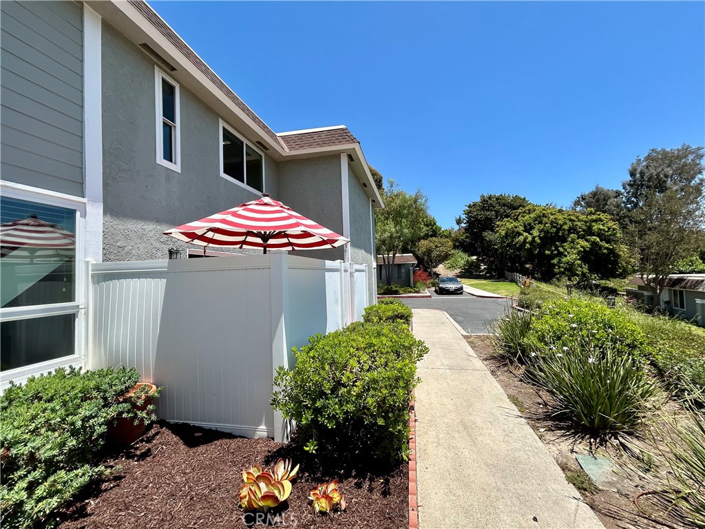 AWESOME PRICE REDUCTION! Welcome home to this wonderful PRIVATE condo located in the lush community of Aliso Villas. LOCATION is key as this home is a quiet END UNIT with no one above or below you. Thoughtfully remodeled in recent years with recessed lighting, porcelain tile flooring throughout, updated baths and kitchen! (All windows are less than 10 years old and AC was replaced in 2018.) Entertain your friends and family in this inspiring kitchen, accented with quartz countertops, tile backsplash, farmhouse sink and Samsung appliances. The dining area is adjacent and a new vinyl 8 ft. sliding patio door leads you to your sunny, very private patio with gate and vinyl fencing. Upstairs the primary bedroom suite is complete with a renovated bathroom, ceiling fan and recessed lighting.
The secondary bedroom is very close and could accommodate a private bath if desired. Call agent for details...The laundry area is located in the attached one car garage, there is also an assigned parking space close by. Sparkling pool and tot lot for the kiddos is just steps away from your front door. At your option, this property allows you to take advantage of a membership to Lake Mission Viejo with private beaches, concerts and boating.