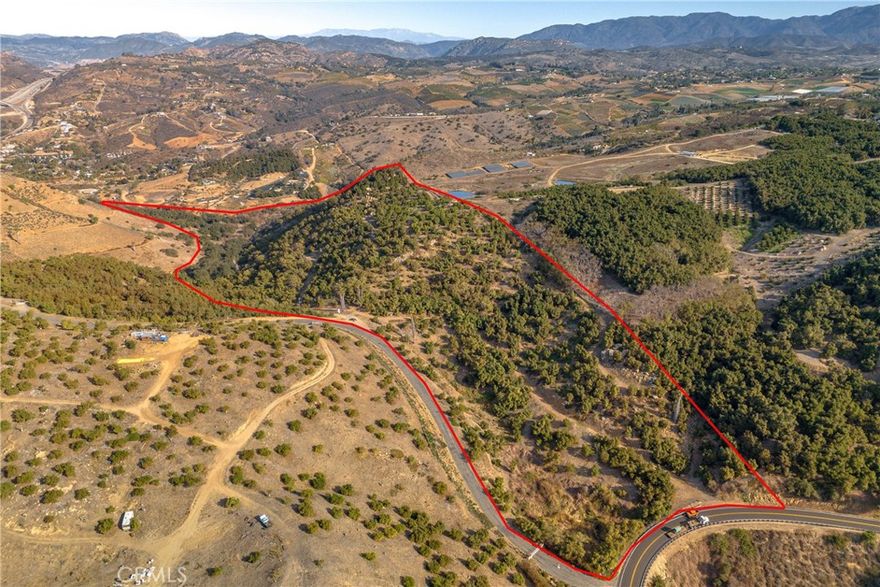 This pristine and rare 44.53-Acres Organic Haas Avocado Grove has approximately 1,800 Productive Organic Hass Avocado Trees and has been Professionally Managed and Well Maintained throughout for years. The Owner has been cutting old trees and planting new trees in the recent years. The majority of the property is made up of 30+/- acres of Hass avocado trees, and there are also extra spaces for more trees, possibly lemons or a nice 14+ acre vineyard in its lower area near the stream that meanders through the lower north end of the property. The land maybe Sub-divided into More Parcels for Multiple Homes Project - Buyers to verify - No house at this property currently, but the homesite and septic layout can design a beautiful home lies at a high point east above the entrance overlooking the Castle Creek Golf Course area, south to Escondido and north over the Camino Del Rey area of Bonsall, with the picturesque arch bridge over I-15 in the far distance. There is a well at the higher level near the entrance off Camino De Las Lomas adding to the mix and the grove is blessed with a good road system and a 2nd way out at the lower northern portion. In the future, another well or two could be drilled in that lower area, with the goal being to make the grove more sustainable, using its own natural water treated with an RO system, which may end up being of better-quality water than what the district provides…PLUS ITS YOUR OWN WATER! This Grove is one of the MOST PROFITABLE AND FINEST GROVES in the area! A MUST SEE! The Asking price includes all the Trees/Fruits with Productive Income and Equipment on the sites. The owner will provide the Existing Income and Managment Company's resources. This Grove Property shares the Gated Entrance to the upscale Camino De Las Lomas neighborhood and its formal entrance is located off to the right of the first left hand turn.