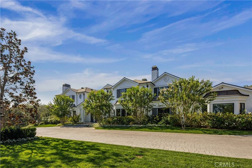 Sweeping pastoral views highlight this beautifully built and very private estate featuring a 10-car garage, and nestled on a lushly landscaped 1.89 acre lot. Sited on a newer cul-de-sac of all custom homes, in an excellent, central Hidden Hills location, you'll step through the entry doors into a world of quality and luxury living. Highlights of the sunny open floor plan include a gorgeous chef's kitchen with two islands & adjoining great room, a spacious formal dining room with refrigerated wine cellar & butler's pantry, entertainer's lounge with wet bar, custom home theater, large custom office, gym/spa with full bath & steam shower, big game room, and a bonus/playroom. The spacious primary suite offers sweeping pastoral views & includes a fireplace, walk-out balcony, luxurious bath with dual showers & two big custom closets (one fronted by a locking steel door), plus there are 5 additional en suite bedrooms. Additional amenities include a whole home, reverse osmosis water system and a whole home, gas powered back-up generator, plus a Savant smart home system, I-Pad controller for lights, music, theater, HVAC & pool, a WIFI & speaker system, Nest thermostats, touch pad security, cameras with recording system, tankless water heaters, a full safe room, a commercial elevator and a slate roof. The amazing and very private grounds feature a covered barbecue pavilion, zero edge pool/spa with Laminar water feature and LED lighting. With an excellent, central Hidden Hills location, and close to the highly ranked neighborhood schools & shopping, this beautiful custom estate has much to offer.