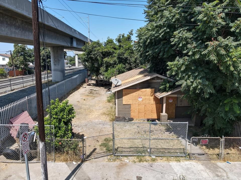 Great opportunity for Investors/developers with the new 2025 re-zoning changes SB1211. This sale includes 2 single family residences located at 1701 and 1703 E. 61st. street Los Angeles Ca in 90001 area. Each home is built on it's own parcel and being sold together, these 2 parcels are adjoined. Investors are advised to do their own dual diligent inspections and investigations and encouraged to call or visit the L.A. County Regional Planning Southwest Field Office on Imperial Hwy for further details. The front house/parcel which is 1701 with a parcel number of 6009-008-024, is a 2 bedroom 1 bath home with a living square footage of approx. 580 built on a 2,923 sqft lot. It currently has fire damage which has affected the interior. The back house/parcel, which is 1703 61st. street with it's parcel number of 6009-008-025, is a 2 bedroom 1 bath with a living square footage of approx. 496 built on a 2,366 sqft. lot. Despite the condition, these properties are an exceptional opportunity for possible rehab/or for development and expansion. This neighborhood is conveniently located near local amenities, schools, shopping centers, churches, parks etc. with easy access to major highways and public transportation. Great opportunity for multifamily housing development for a profitable investment, if permitted.