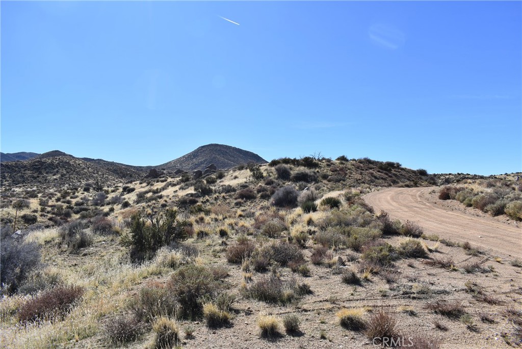2.59 acre lot on Andes Trail on the way from town to the hot springs off Bowman Ranch Rd in Apple Valley. Could make a great AirBnB site. APN 0432-254-02-0000.