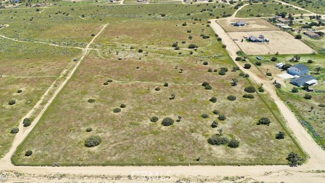 You have found the perfect get a way land lot. Flat, buildable, fully fenced, close to utilities, Mountain View and about 1/2 mile off pavement.