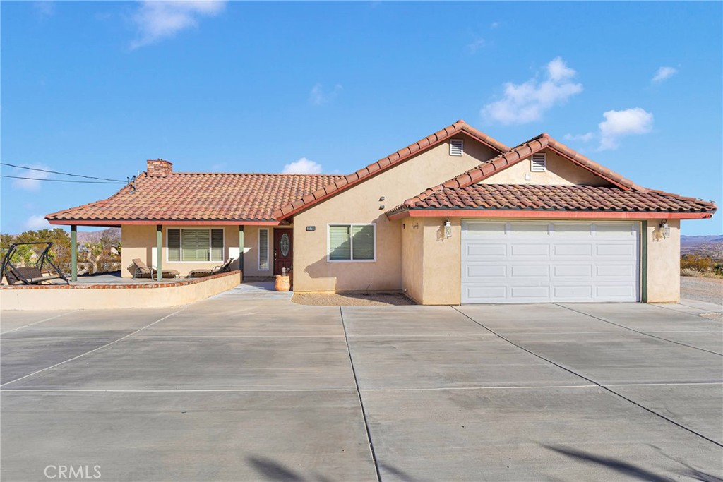 Discover the perfect blend of comfort, convenience, and versatility in this stunning Lucerne Valley property. Nestled on a paved road in one of the area’s most desirable locations, this home offers breathtaking mountain views and desert serenity, with snow-capped peaks visible right from your front yard. Just 30 minutes from Big Bear, it’s a dream location for year-round activities. The open-concept living room and kitchen area is designed for modern living, complemented by beautiful views through updated window shutters. The property is fully equipped for Airbnb hosting with digital locks throughout, a fire sprinkler and alarm system, and Ring security with four exterior cameras for peace of mind. The finished garage is a standout feature, offering its own shower, toilet, sink, and an independent air conditioning/heater split system—perfect as a workshop, guest suite, or place to get cleaned up after a hard days work. Additional highlights include a cement slab for extra parking, a dedicated 120V electrical line, a 40-amp RV electrical box, and an RV dump station with water access. 16 tons of dirt were brought in to create an RV parking area and a convenient ramp for driving around the property. Enjoy an extended concrete driveway for ample parking and a low-maintenance lifestyle with modern conveniences at your fingertips. With a motivated seller and a price to sell, this home is an incredible opportunity to own a slice of Lucerne Valley’s natural beauty and functionality. Schedule your showing today and unlock the potential of this remarkable property!