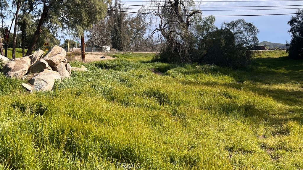 Presenting prime vacant land at Mountain Ave & Hwy 74, Perris, CA 92570. This corner lot, comprising two parcels totaling .37 acres (16,117 square feet) Boasts frontage along the bustling Highway 74 corridor. Positioned within the Highway 74 Business Corridor Re-designation Plan, it's ideal for immediate development or as a strategic investment for future growth.