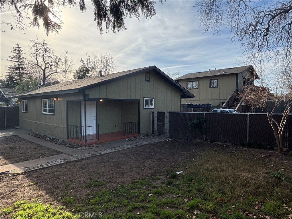 Two separate units on one lot. Main house is a 3 bedroom 2 bath home that has been remodeled with new roof, new paint in/out, new flooring, new doors and baseboard, and new kitchen with granite counters. The main house has private fenced yard and laundry hookups. The second unit is located above the garage and has 1 bedroom and 1 bath with laundry hookups. Each unit has its own electric and gas meters.