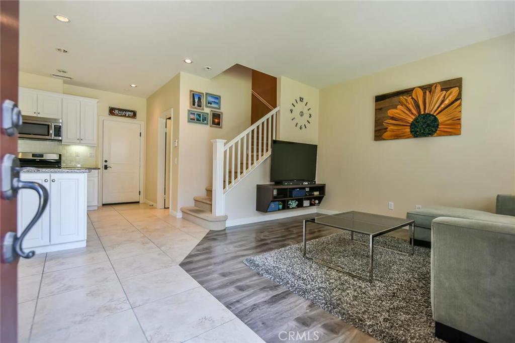 Elegant. Contemporary. Luxury. Spacious design and highlighted with distinctive architectural details, this astounding 2-level, 3 beds, 2.5 baths, 1,523 sq.ft. townhome is located in the highly sought after community of Colony Park in The Downtown Historic District of Anaheim. Open-concept floor-plan, modern gourmet kitchen, kitchen island, granite countertops, subway tile backsplash, custom hand-built cabinets/pantry, stainless-steel appliances, 9 foot ceilings, recessed lighting, stone/travertine floors, aspen-wood laminate floors in living area, dual-pane windows, laundry room, A/C and Heating - all that you desire in a home is here. All bedrooms are upstairs plus a full bath (guest half bath is downstairs). The master suite features its own private en-suite bath with a soaking tub & shower, dual vanity, and a custom wardrobe organizer. Additional, an attached 2 car garage has garage opener w/Wi-Fi and external pad. Enjoy resort-like community amenities - 3 sparkling salt water pools, 2 spas, covered outdoor pavilion w/BBQ & fire pits areas, club houses, exercise room, water course, playground, and dog park. Conveniently located near the Anaheim Packing House, Anaheim Town Square, Disneyland Park, the 5 freeway, and much more! An absolute must-see!