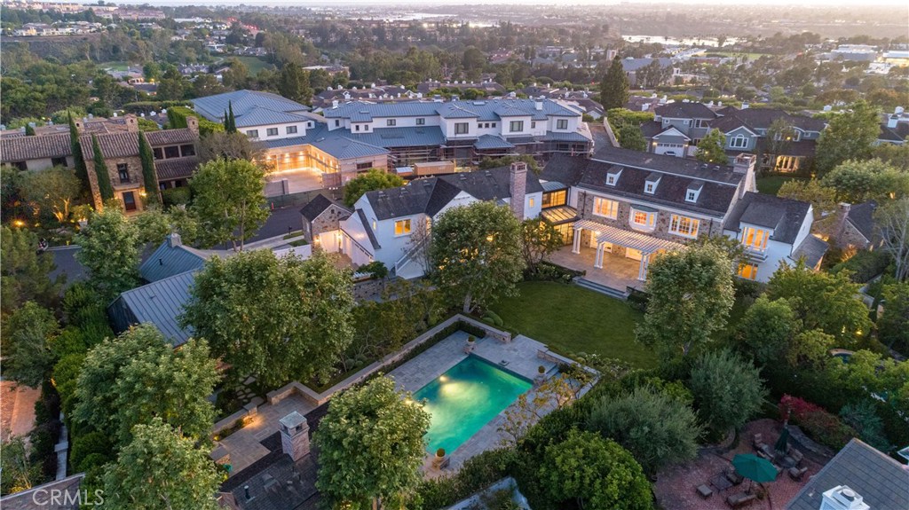 In the classic tradition of the first grand estates of Bel Air and Holmby Hills, this custom estate compound provides a gracious and uncommon living experience. This stunning residence is an homage to Pennsylvania Dutch Colonial design, and bears all the hallmarks of exceptional traditional architecture. The home expertly merges the history and artistry of a bygone era with all the valued amenities of a modern domain. The main house of approximately twelve-thousand square feet is situated on a parcel of approximately one acre and is graced with six bedroom suites, formal living and dining rooms, a distinguished library, two family rooms, an atelier, a wine room, and theater area. It is finished with Pecan floors, crisp white paneled and lacquered walls and ceilings, custom windows+doors+fixtures. It is perfection. Two detached guest houses, a pool court and pool pavilion, multiple garages, staff quarters and office, a gated motor court, as well as catering kitchen complete the offering. Enveloped in mature gardens and opening to expansive blue stone terraces on all sides, this is the ultimate family and entertaining home. The residence, outbuildings and spacious grounds stand, collectively, as perhaps the most exquisite compound ever created in this area.
