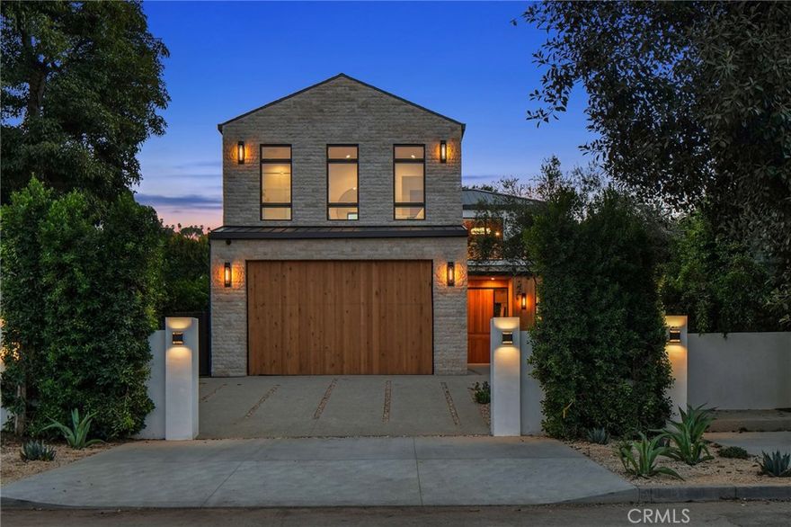 Situated South of the Boulevard on one of the most desirable streets in Sherman Oaks, this brand-new construction estate offers a 5-bed, 5-bath main house and 1-bed, 2-bath ADU. This meticulously designed home features a warm, inviting interior filled with rich natural wood, rare imported stone and expansive glass walls that bathe the open floor plan in natural light. An oversized sliding glass door spans from the kitchen to the living room, seamlessly extending your living space outside for true indoor-outdoor living. Prepare gourmet meals in the designer chef’s kitchen, equipped with top-of-the-line Miele appliances, a massive island with a breakfast counter and walk-in pantry. The adjacent formal dining room is highlighted by a chic wet bar and opens to a side courtyard with a built-in fire pit. Ascend the floating staircase to find four generously sized bedrooms with vaulted ceilings, a well-appointed laundry room and loft area with built-in bookcases. Unparalleled luxury awaits you in the primary suite, which boasts a pocket sliding glass door that leads out to a private patio, custom walk-in closet and opulent ensuite bathroom, complete with a soaking tub, oversized rainfall shower and dual vanities. Head outside to the serene backyard retreat and take a dip in the refreshing resort-style pool/spa. There’s also an outdoor kitchen with bar seating, ample patio space for al fresco dining, a low maintenance artificial turf yard and privacy hedges that surround the home. At the rear of the property resides a versatile 1-bed, 2-bath ADU with a living room and full kitchen, ideal as a separate living space for extended family/guests, office or gym - the possibilities are endless. Additional amenities include a state-of-the-art home theater, main-level ensuite bedroom, high ceilings throughout, a Control4 smart home system with built-in speakers and security system. Situated in the heart of Sherman Oaks, this property is only moments away from trendy restaurants and boutique shops found along Ventura Boulevard, and offers easy access to the Valley, Westside, 101/405 freeway and so much more.
