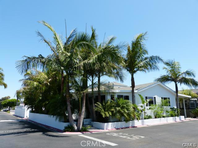 Tropical Paradise infused with breezes from the Bay ! Only 100 yards from Bayside Village’s private Bay Front Beach, this Manufactured home on a triple-wide, single story home on a land-lease lot has been completely remodeled. Contemporary styling 3 bdrm./2 full bathrooms; this privately located home enjoys views of the park and clubhouse/pool area across the street. Open, fresh and move in condition makes this a great value. For a second home, it is the perfect solution. Upon sale, the land lease will be approximately $1,790/mo which includes payment of the prorata property tax, maintenance of the community amenities.