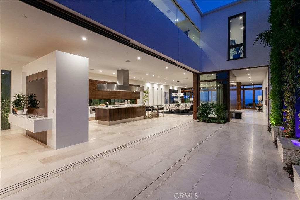 2908 Ocean sold before completion, entered for COMP purposes only.
This warm new contemporary residence embodies the comfort and allure of coastal lifestyle. With approximately 8,310 square feet of living space, 2908 Ocean Blvd. rests on one of the largest lots in Corona del Mar. Unmatched oceanfront views and the luxury of expansive outdoor entertaining space exemplify this home’s timeless appeal. Enjoy captivating sunsets with guests on its expansive and inviting outdoor deck, draped by lush tropical foliage. The generous interior lends itself to entertainment with a media room, 5 bedrooms, 6 full & 2 half bathrooms, and 4-car garage. Situated within walking distance to world-class shops & restaurants, the charming ocean-swept town of Corona del Mar is at your doorstep.