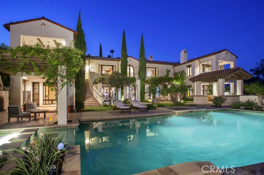 This remarkable Santa Barbara style home provides a proud gated sanctuary on the most prestigious street in San Juan Capistrano. Nestled on over an acre and sitting high on the hill, one enjoys ocean views while being surrounded by plush landscaping.  While sitting on the edge of the infinity pool let your imagination picture the pool flowing into space.  The main house features 6 en-suite bedrooms and 3 additional half baths.  The gourmet kitchen with butler's pantry is adjoined by the comfortable family room.  Formal dining room, living room, game room, media room plus wine cellar complete the main house.  An elevator brings your groceries from the garage to the kitchen.  The separate guest house (estimated 1,200 SF) offers two bedrooms, two baths, kitchenette and living room with fireplace, and sits atop a 6-car garage with room for boat storage.