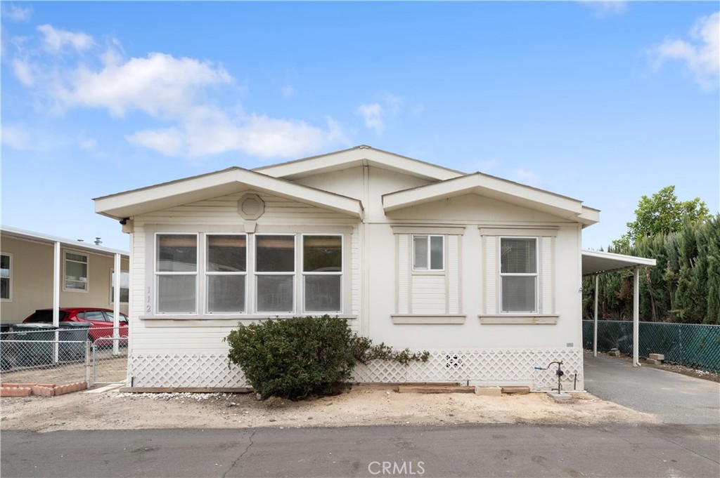 Nestled in the charming Butterfield Village Family Park, this hidden gem in Lake Elsinore boasts three bedrooms and two bathrooms. The kitchen, featuring ample cabinet space, opens up to a comfortable living area. The primary bedroom includes a private bathroom, ensuring a personal retreat within the home. Laundry concerns are addressed with a dedicated room equipped with washer and dryer hookups, streamlining household chores. The property boasts a newer HVAC system, Fresh cleaned carpets, a convenient carport, and a backyard shed. More than just a residence, this community provides a lifestyle experience. Residents have access to amenities such as an association pool, clubhouse, gym, and billiards room, fostering an ideal environment for social gatherings and relaxation. Lakeside High School is conveniently located just across the street. Shopping, restaurants, and Highway 74 are in close proximity, offering convenience and accessibility. Additionally, the property is mere steps away from the lake and its array of amenities. With all these features, this home eagerly awaits its new owner to make it their own.