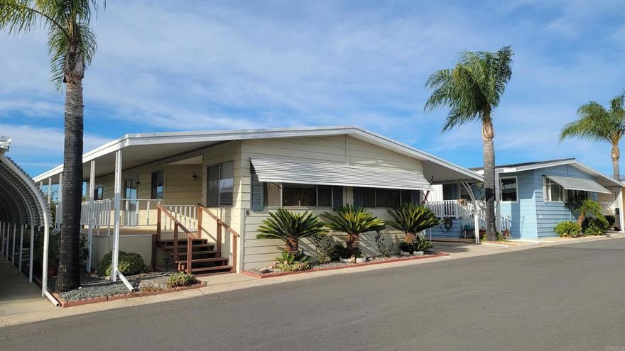 Ramona Terrace Estates is a 55+ senior community. This 2 bedroom 2 bath home is in a great location directly across from guest parking and close to the club house. It is super clean with new laminate flooring and ceramic tile in the kitchen, laundry, and bathes. No Carpet! The large kitchen has plenty of cabinets and NEW stainless double ovens, range, dishwasher, sink and disposal, as well as an eat-in counter for casual dining. A NEW dimensional shingle roof in 2018, and fresh paint completes the update. The formal dining room hosts lighted built-in cabinets. The front living room is huge allowing large furniture. There is a smaller family room by the kitchen and bedrooms. The Master bedroom is large enough to host a king bed and nightstand. The master bath is a throwback to the 70's but large and in good condition.  Outside the carport is 14' wide and 36' deep allowing 2 vehicles. There is a 32' wide ramp for wheelchairs. The 2 steel sheds will stay. The back yard is fully 51' x 16'. The front entry sports a covered 26' x 8' raised deck with new outdoor carpet.