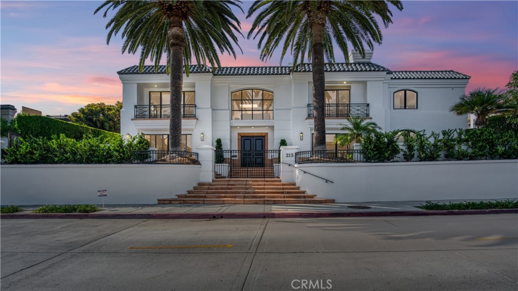 Welcome to 215 Poppy, a significant landmark in the village of CDM created by famed designer Fari. Upon entering this magnificent home, you will notice an abundance of light shining through oversized windows from both floors. This home sits on an approximately 8100 square-foot lot and offers approximately 6014 ft.² of living space. Unparalleled in the village, this rare lot boasts 109 feet of street footage. The elevated lot allows for ultimate privacy yet is steps from the beaches of Corona Del Mar. Downstairs there is a live in “mother-in-law unit”, a huge bonus room with built-in bar and an additional bedroom that opens to the spa and waterfall. Upstairs boasts a sizable home office, a gorgeous master with a massage or workout room, an additional “master” bedroom, a more formal living and dining room and a temperature-controlled wine storage next to the vast chef’s kitchen all accessible via the elevator!
Additional highlights include multiple fireplaces, including one outdoors alongside the fabulous spa with a stunning waterfall and a built in BBQ. One cannot help feeling like you’re living on Billionaires Row in Palm Beach with lush hedges surrounding you. Located just a short walk to world-class dining shopping and all the Corona Del Mar lifestyle has to offer. Ooh La La!
Ooh La La! PLEASE SEE VIDEO OF PROPERTY-ON YOU TUBE 215 POPPY.
