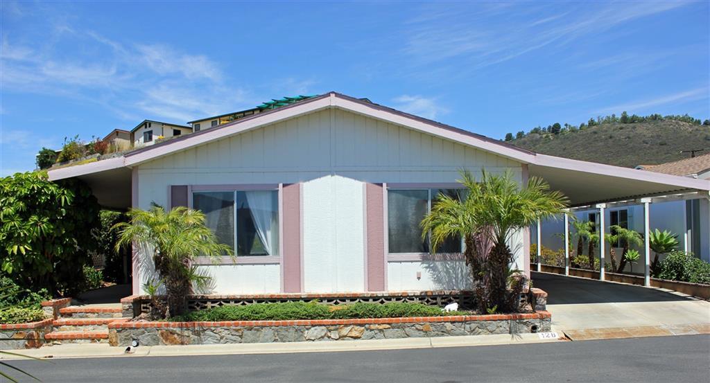 Own your own land in this well sought after 55+ community that is ground set; no steps to climb into the home like most other manufactured homes! The is one of the few FHA & VA approved communities! Split bedroom floor plan is very open with lots of natural light, two skylights & vaulted ceilings. Dining bar off of Kitchen. Spacious laundry room with extra storage. New water heater in 2014. The large covered patio is very private and leads back to a beautiful rose garden in the backyard. See suplement Neighborhoods: Foothills Equipment: Dryer, Range/Oven, Shed(s), Washer Other Fees: 0 Sewer: Sewer Connected Topography: LL